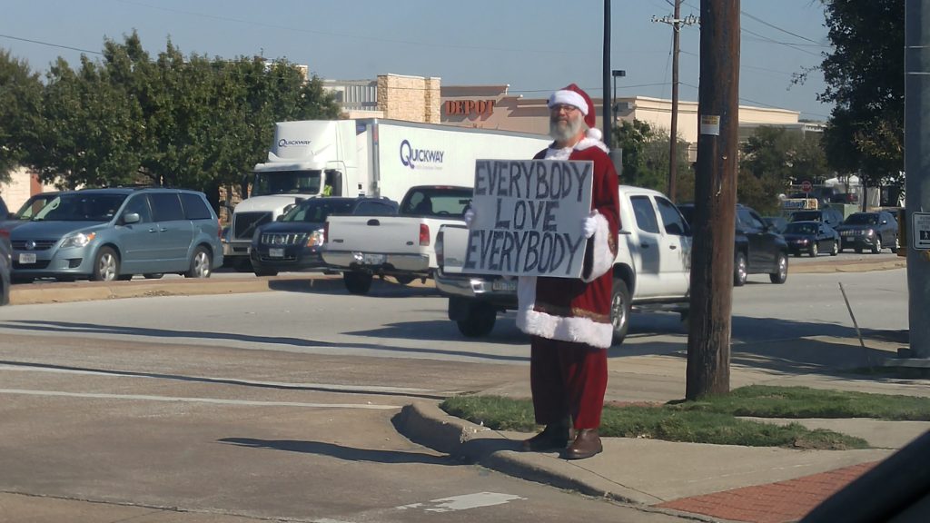 Man in Santa suit trying to bring cheer to drivers in Keller, TX. 